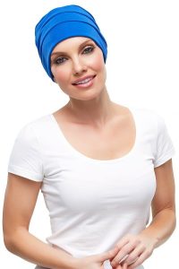 Lady with total hair loss wearing the blue Jon Renau Tammy Hat